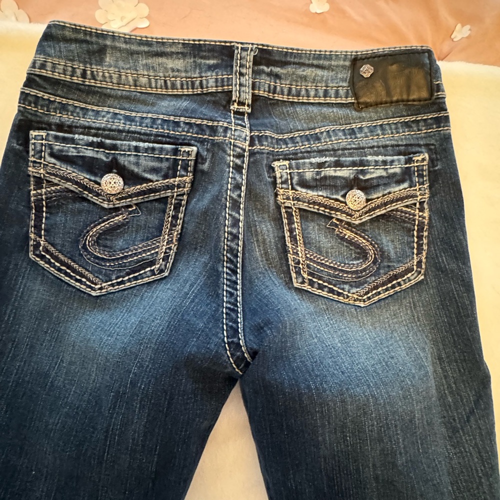 Silver Jeans in the Suki Mid Slim Boot line, size 28W/31L.